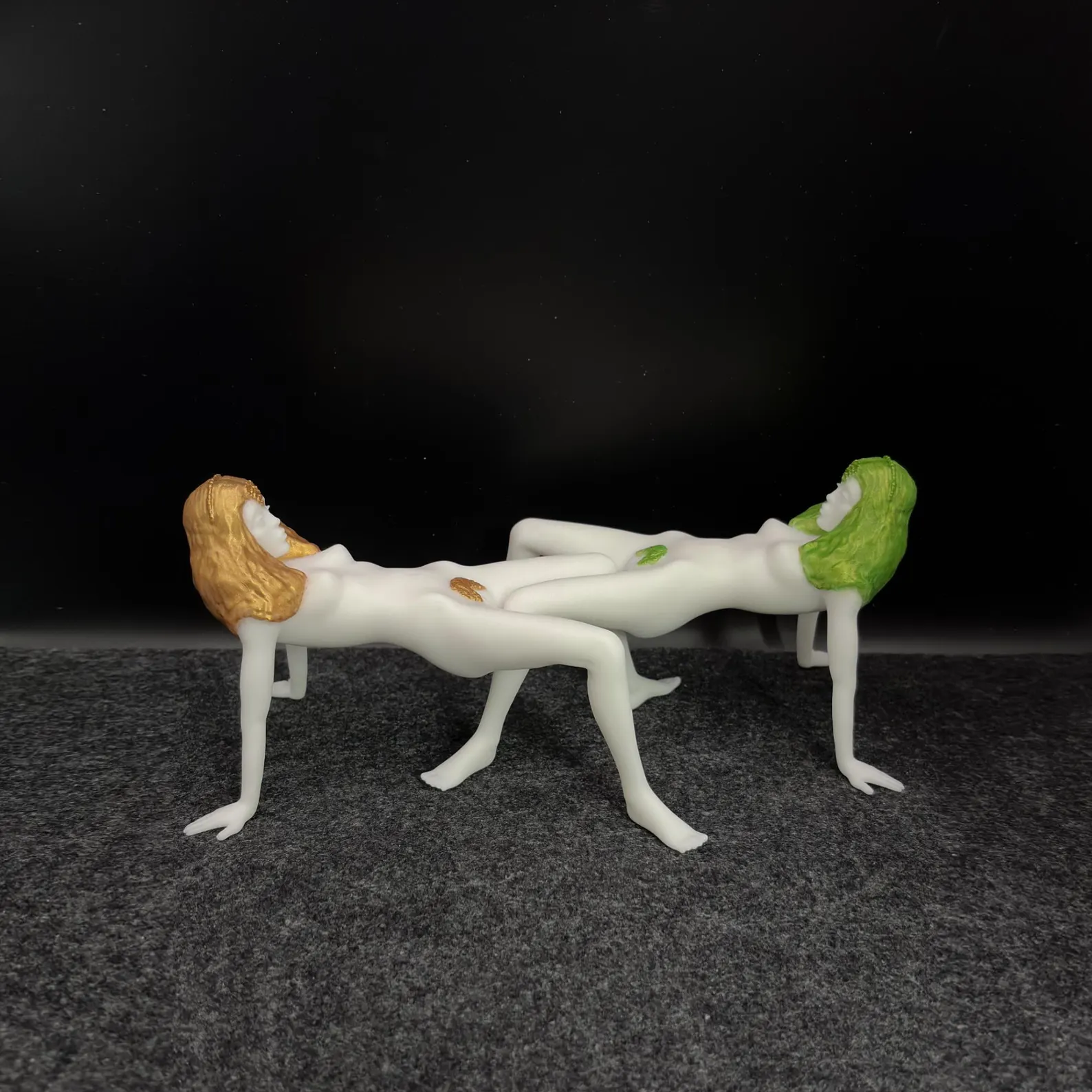 Two white Korova Milk Bar Tables with hand-painted hair, one orange and one green
