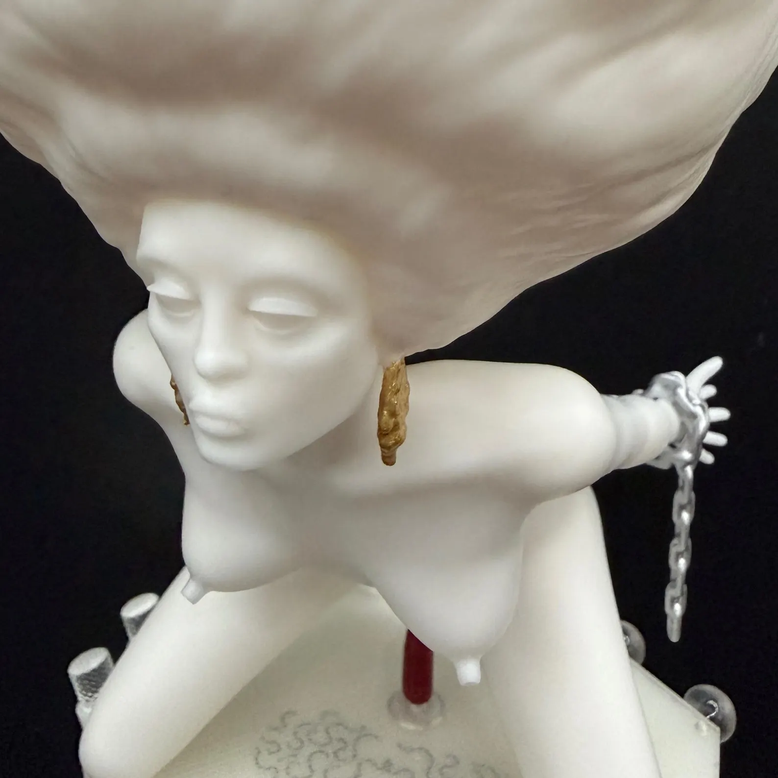 Close-up of the Korova Milk Bar Maid face, sculpted hair and gold-coloured earrings