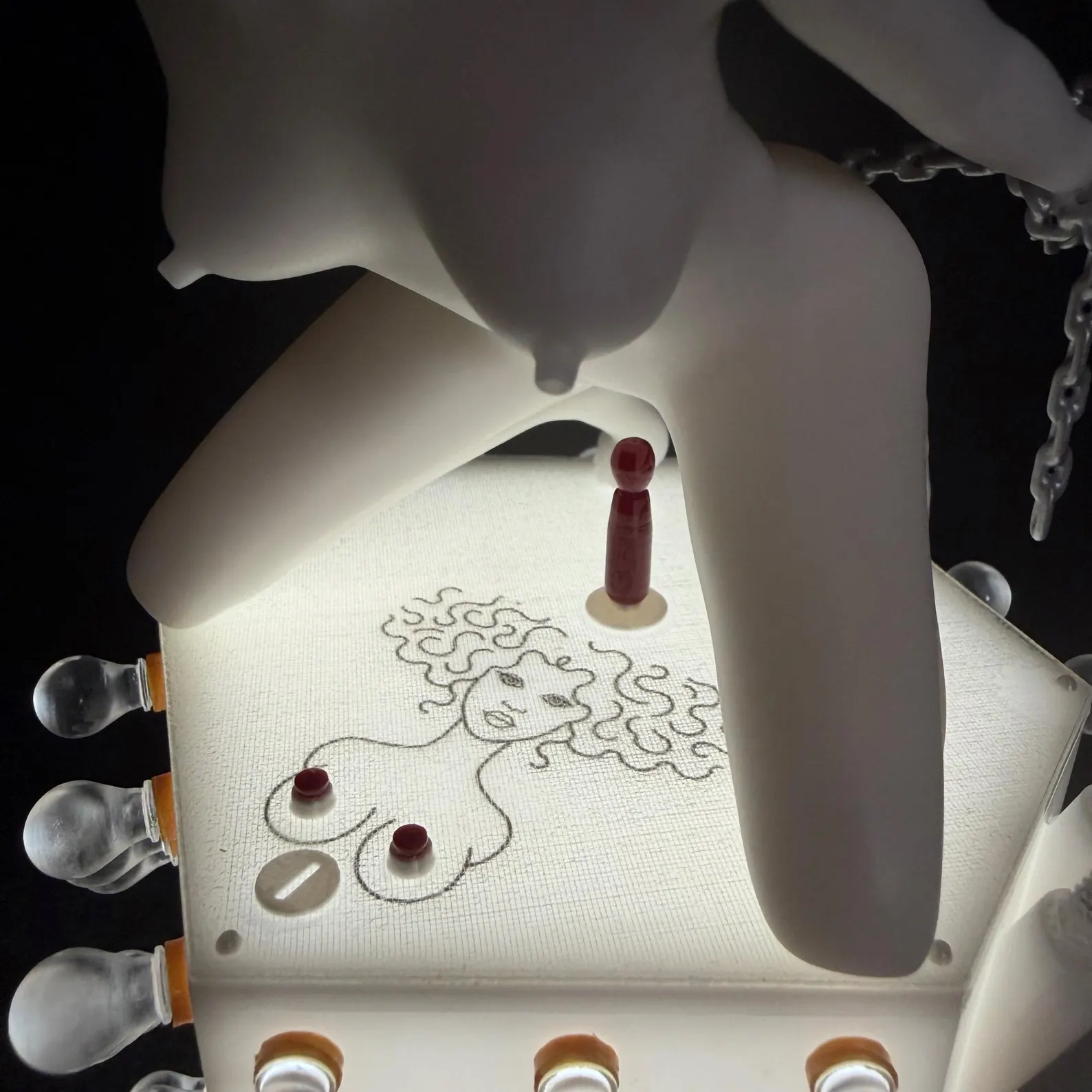 Close-up of the illuminated Korova Milk Bar Maid base and decorative details