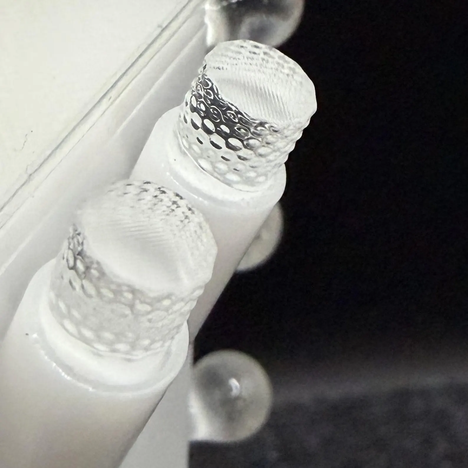 Close-up of the two textured clear glasses on the Korova Milk Bar Maid base